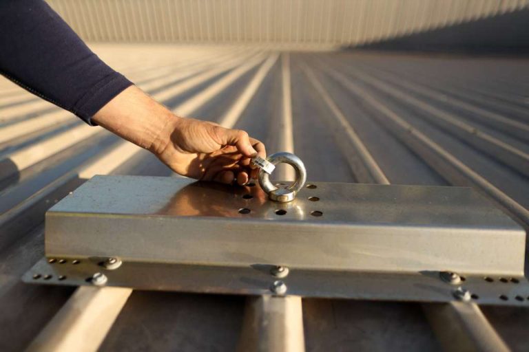 Technician conducting safety inspecting - roof anchor